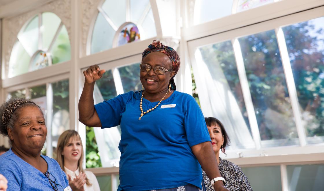 Black woman dancing at talent show in front of audience